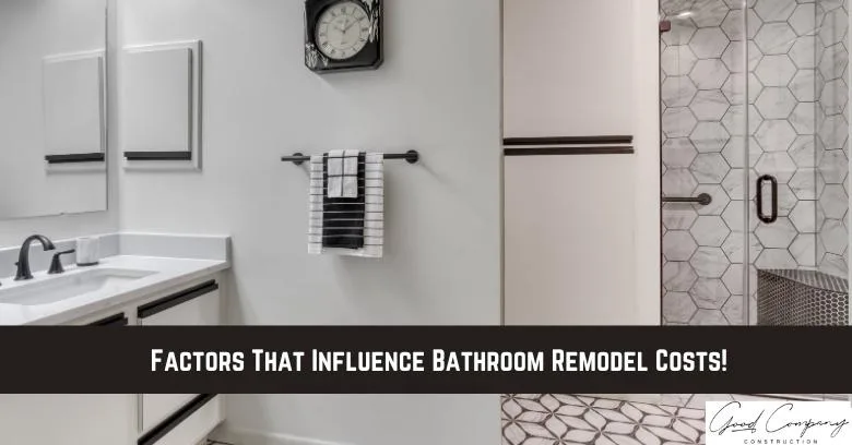Modern bathroom featuring a white vanity, mirror, towel rack, and a glass shower with hexagonal tile. Text overlay reads: Factors That Influence Bathroom Remodel Costs!.