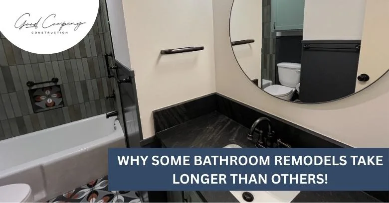 A modern bathroom features a bathtub, round mirror, toilet, and dark sink countertop with the text Why some bathroom remodels take longer than others!.